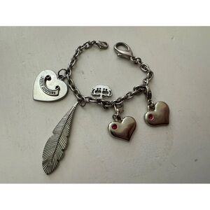 Juicy Couture silver tone charm bracelet heart crown feather